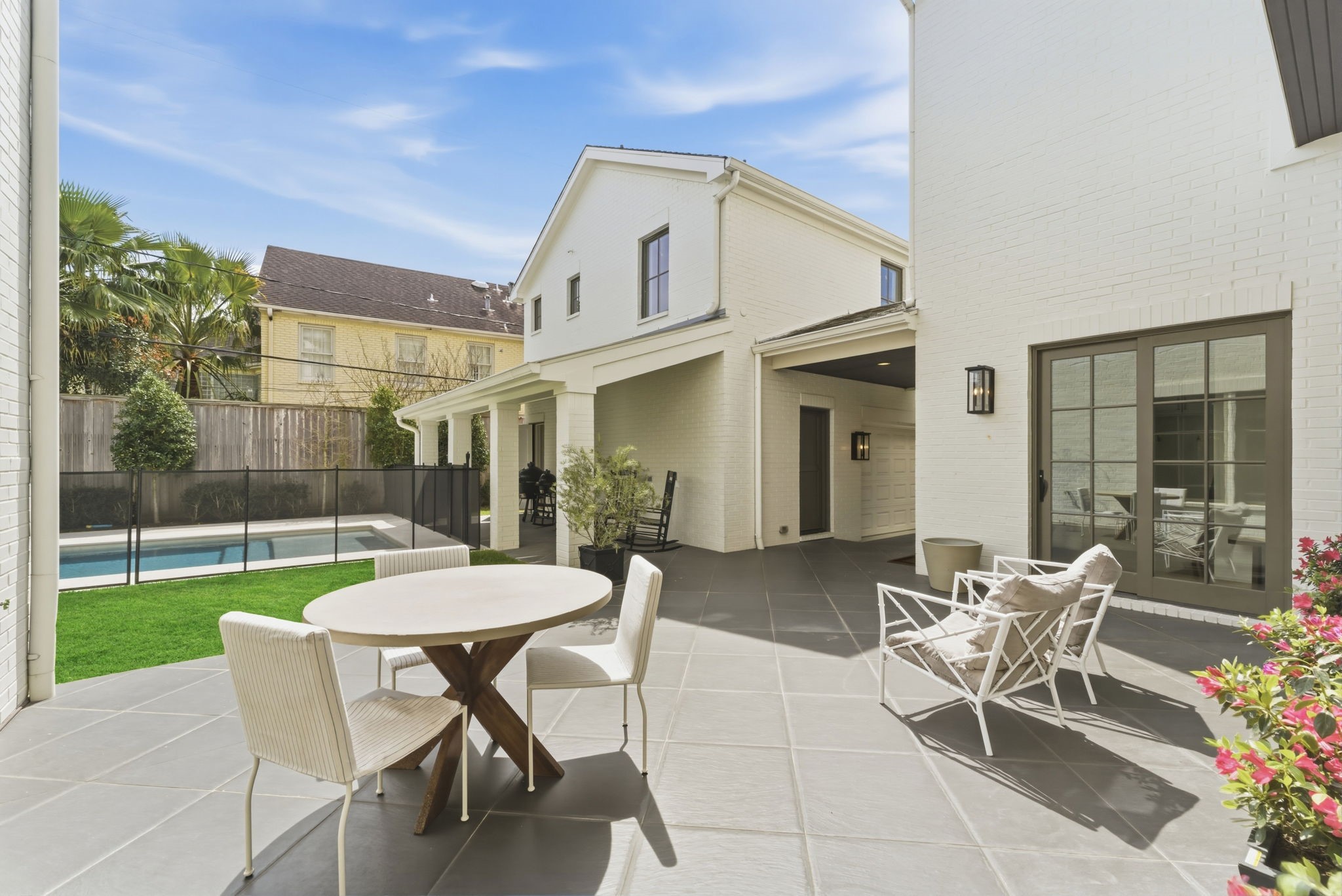 2211 Troon Road Houston, TX 77019 - Photo 39 of 44 a view of a patio with table and chairs and potted plants