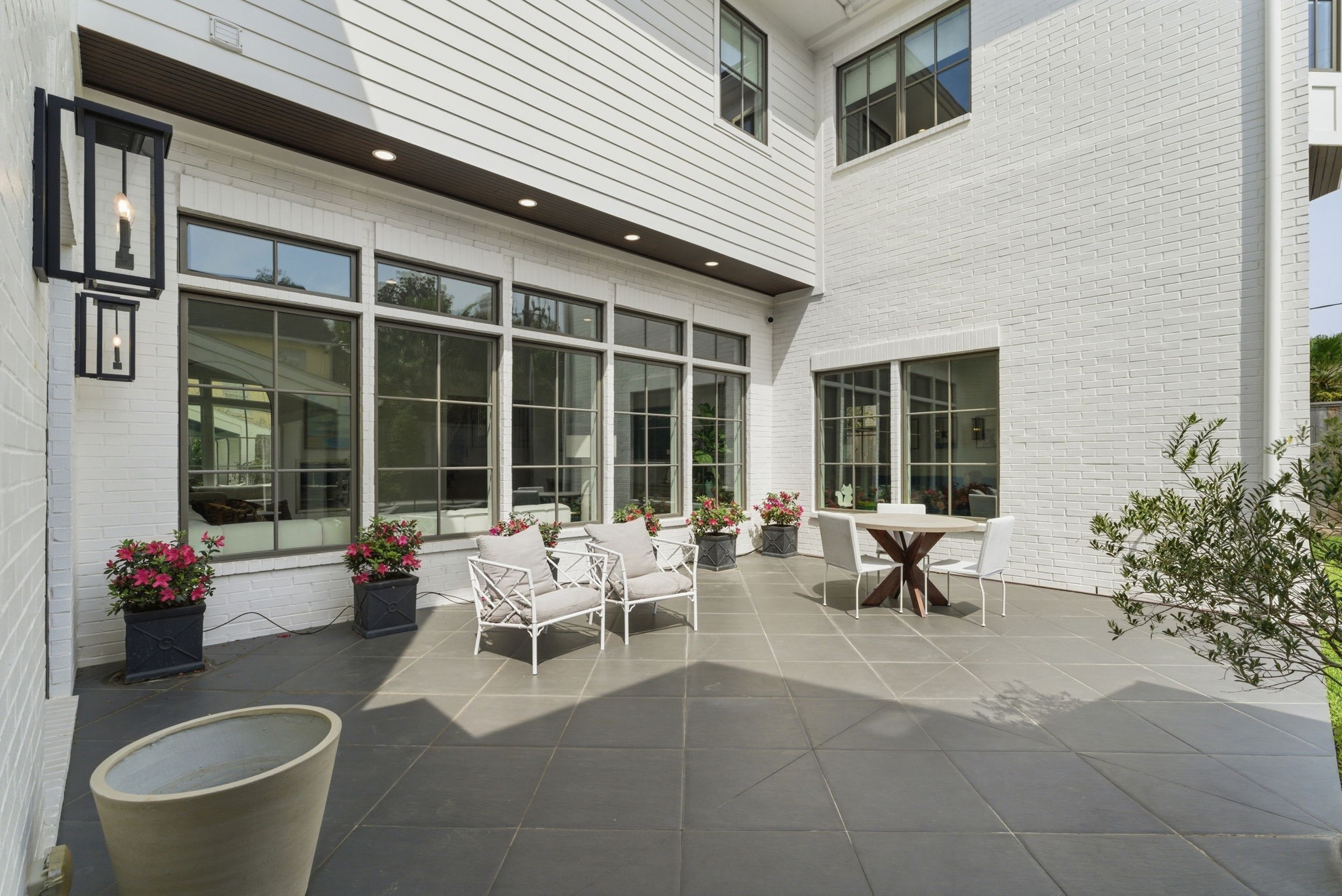 2211 Troon Road Houston, TX 77019 - Photo 40 of 44 a building outdoor space with patio furniture and potted plants