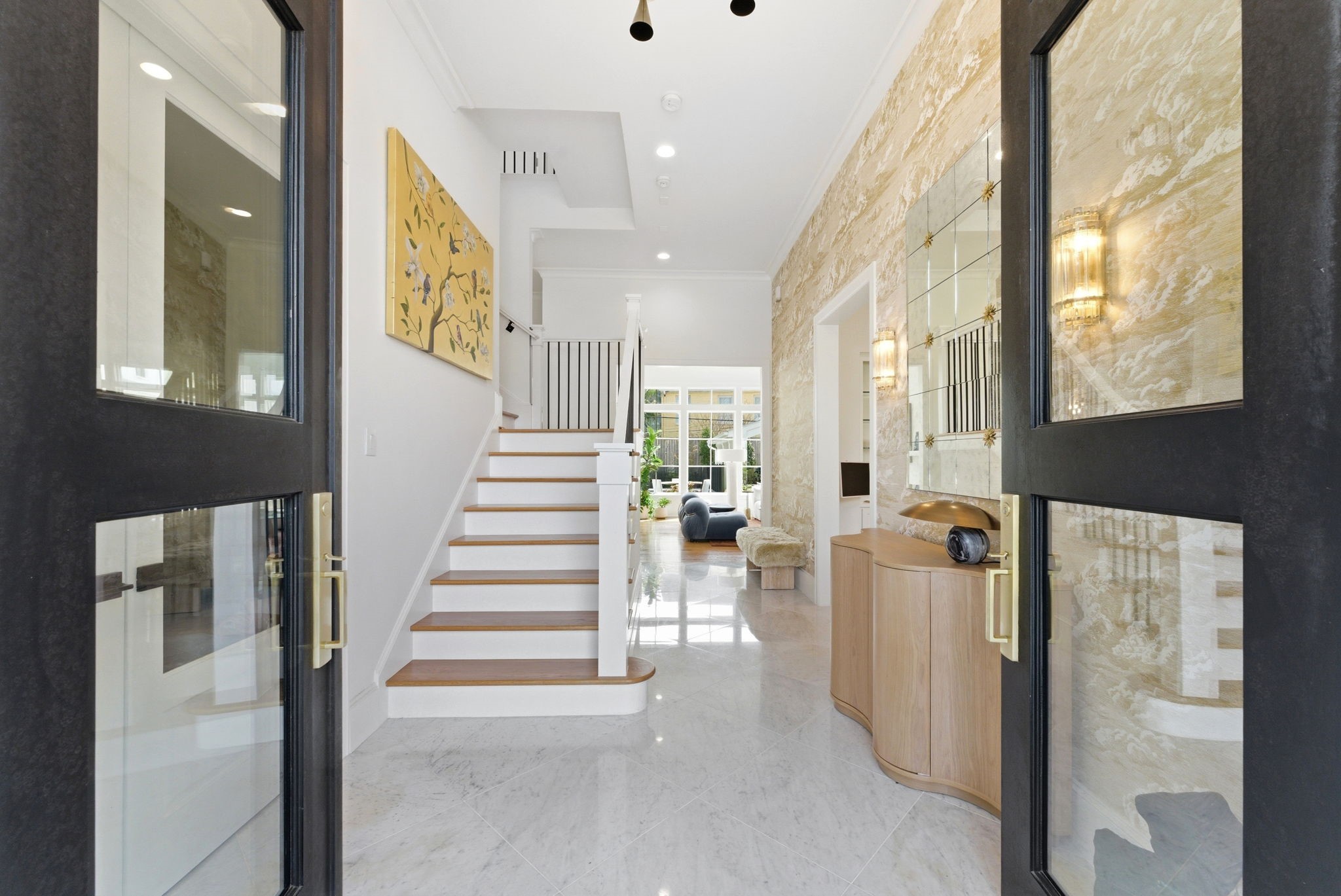2211 Troon Road Houston, TX 77019 - Photo 4 of 44 a view of a hallway with wooden floor and windows