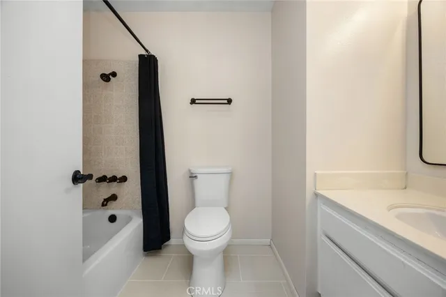 an aerial view of a houses with yard