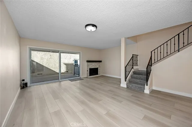 a kitchen with cabinets appliances a sink and a counter top space