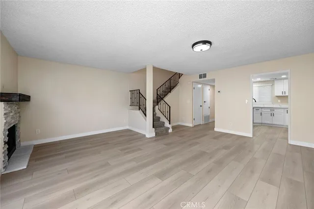 a kitchen with white cabinets stainless steel appliances and sink
