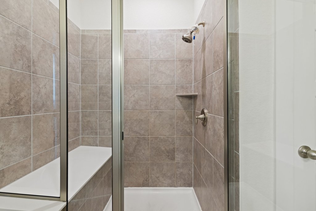 7409 Merrick Lane, Unit 40 Austin, TX 78745 - Photo 18 of 37 a bathroom with a shower and a sink