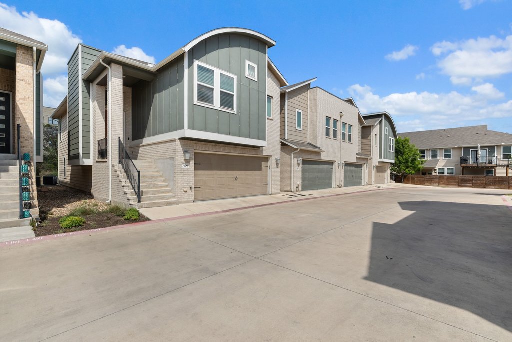 7409 Merrick Lane, Unit 40 Austin, TX 78745 - Photo 2 of 37 a view of a white house with a road