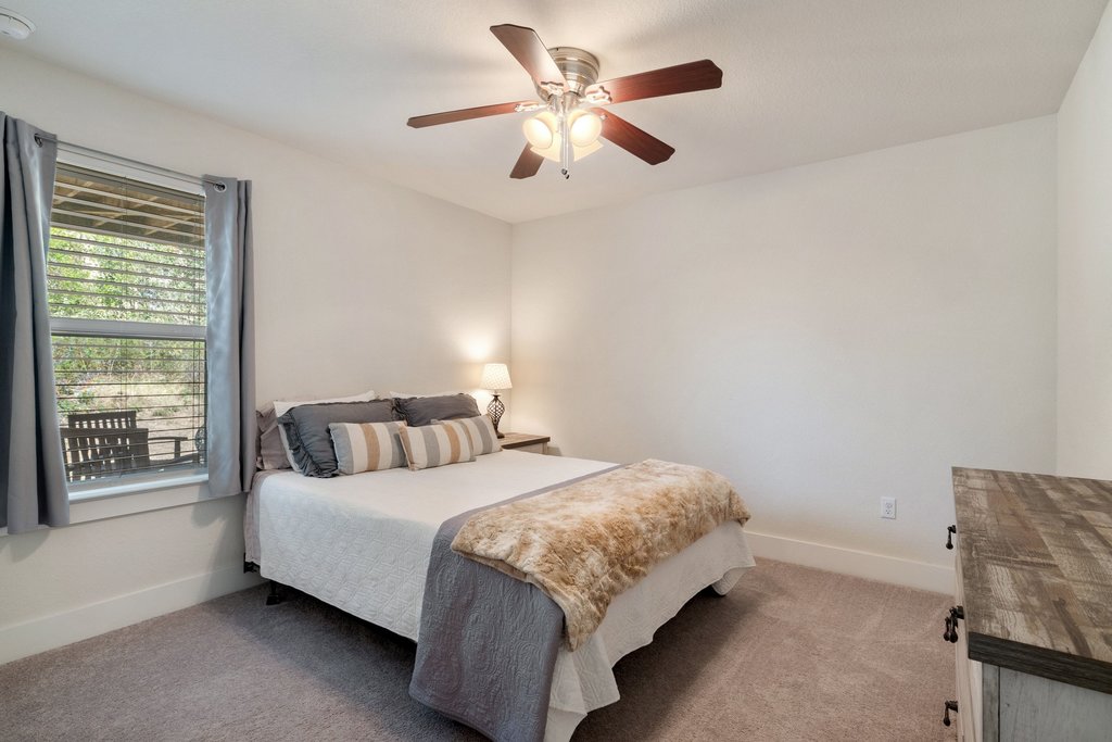 7409 Merrick Lane, Unit 40 Austin, TX 78745 - Photo 23 of 37 a bedroom with a bed and a window