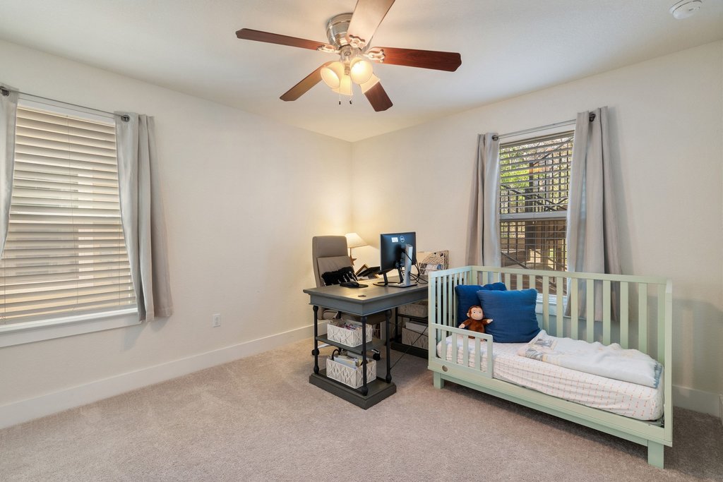 7409 Merrick Lane, Unit 40 Austin, TX 78745 - Photo 25 of 37 a view of a workspace with furniture and a window