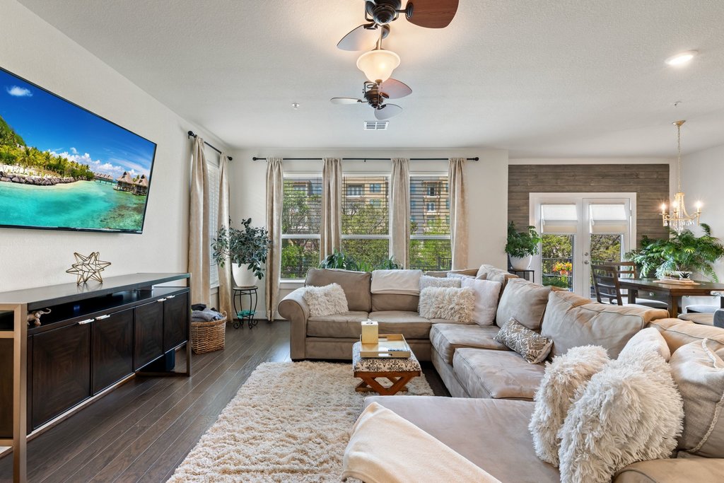 7409 Merrick Lane, Unit 40 Austin, TX 78745 - Photo 8 of 37 a living room with furniture large window and flat screen tv