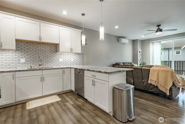 a kitchen with a sink cabinets and window