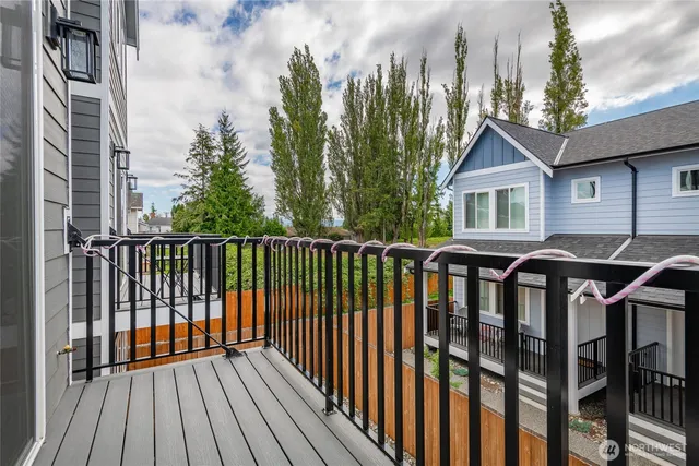a view of a wooden deck and a yard