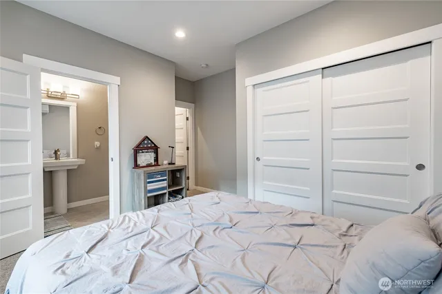 a bedroom with a bed and a dresser