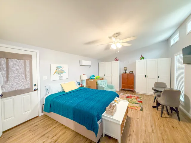 a bedroom with a bed and a table in it