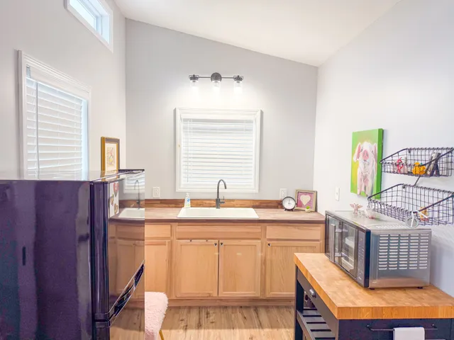 a kitchen with stainless steel appliances granite countertop a sink stove and cabinets