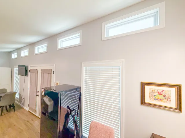 a view of a livingroom with furniture and windows