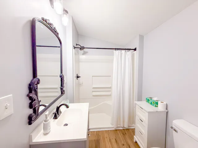 a bathroom with a tub and shower