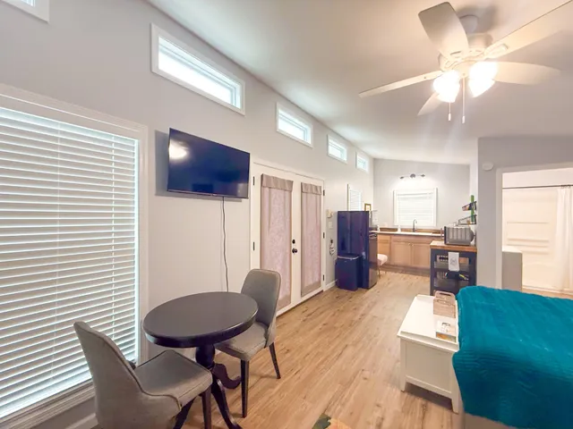 a view of a dining room with furniture and wooden floor