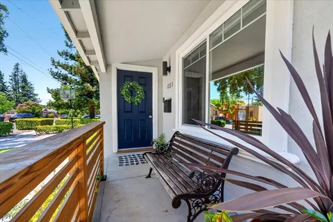 a view of balcony with wooden floor and outdoor seating