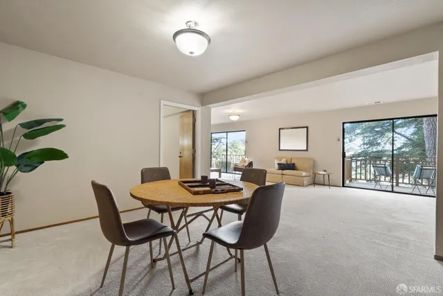 a living room with furniture and a table