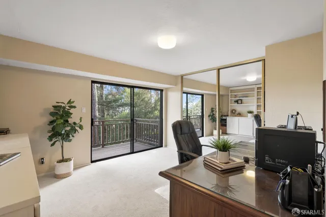 a view of a workspace with furniture