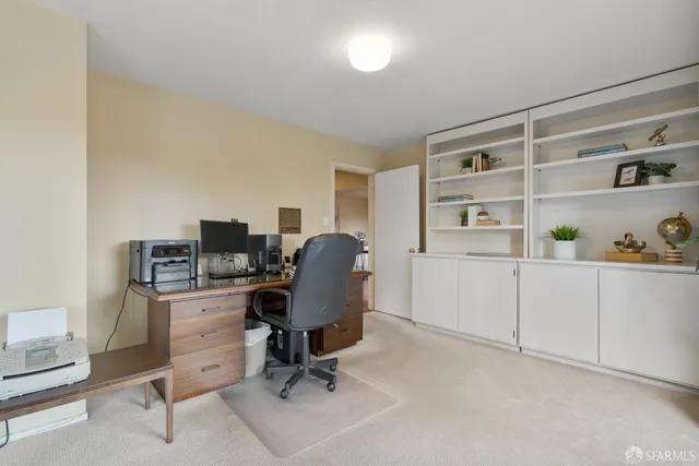 a bedroom with a bed and glass window