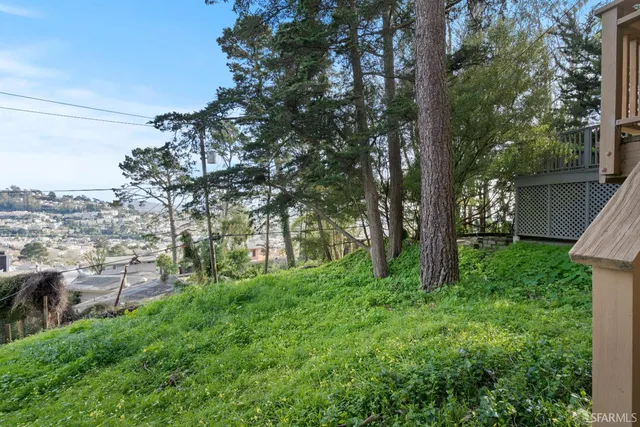 a view of a two chairs in the balcony