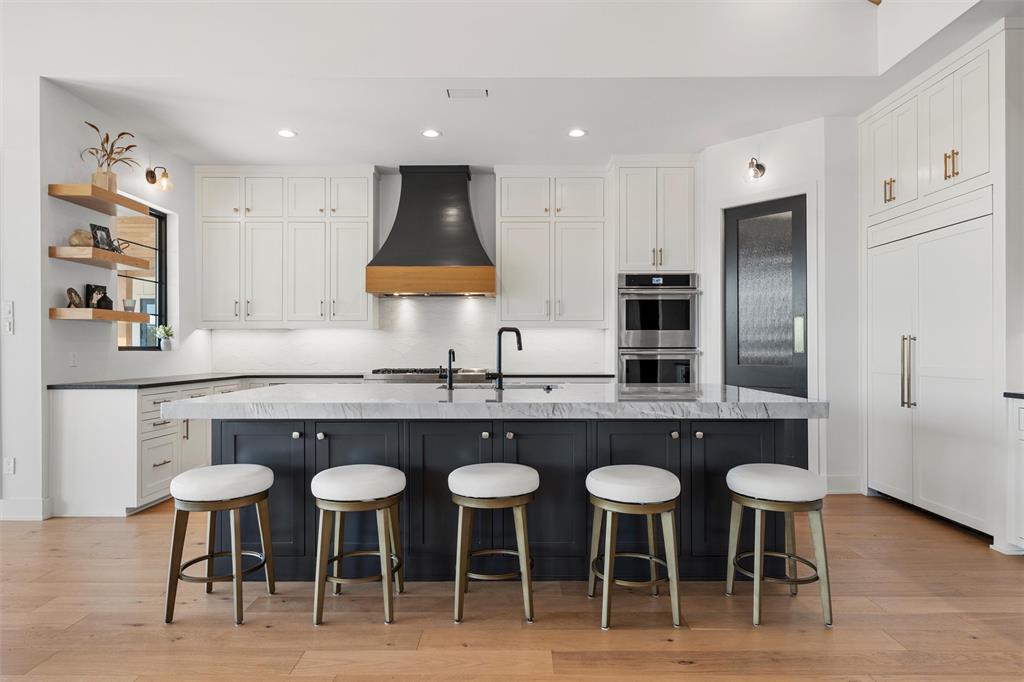 477 Wolf Creek Road Lorena, TX 76655 - Photo 13 of 40 a kitchen with cabinets and chairs