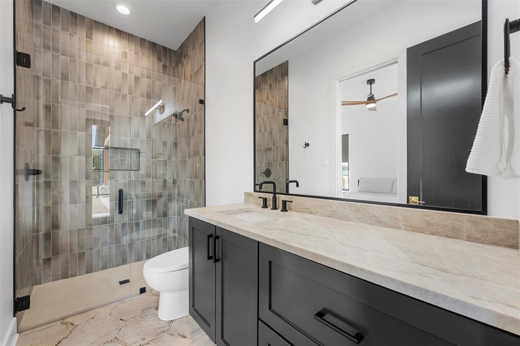 477 Wolf Creek Road Lorena, TX 76655 - Photo 27 of 40 a bathroom with a sink and a mirror