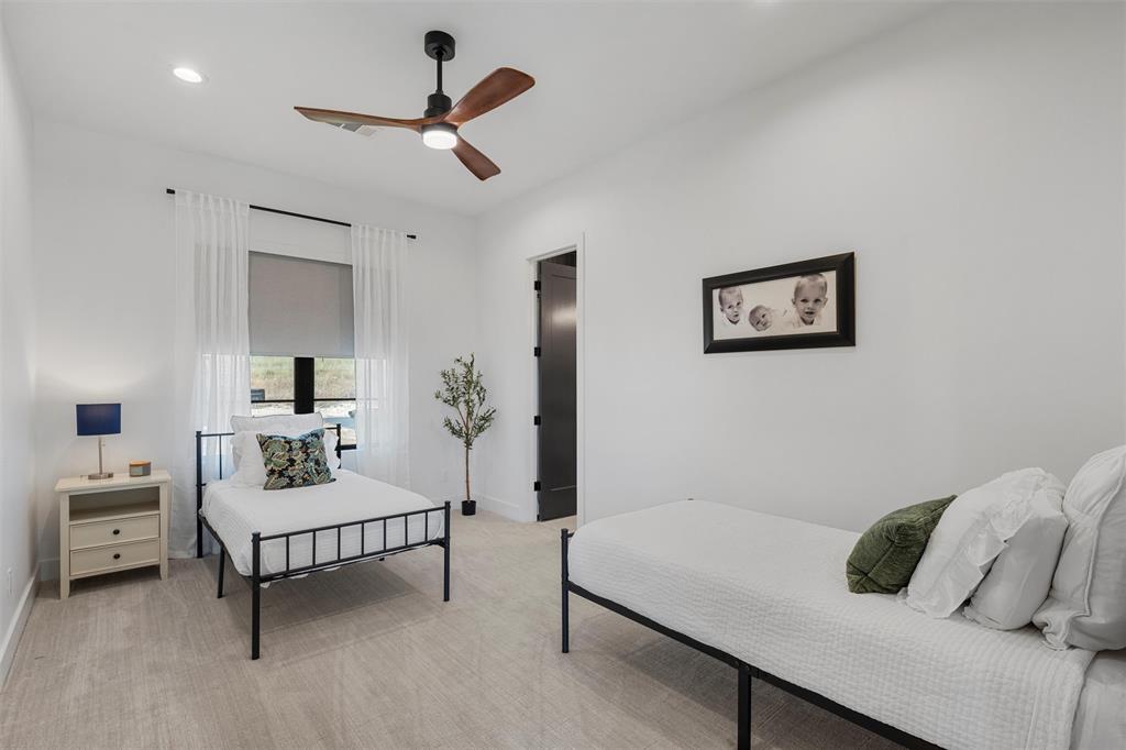 477 Wolf Creek Road Lorena, TX 76655 - Photo 28 of 40 a bedroom with furniture and a window