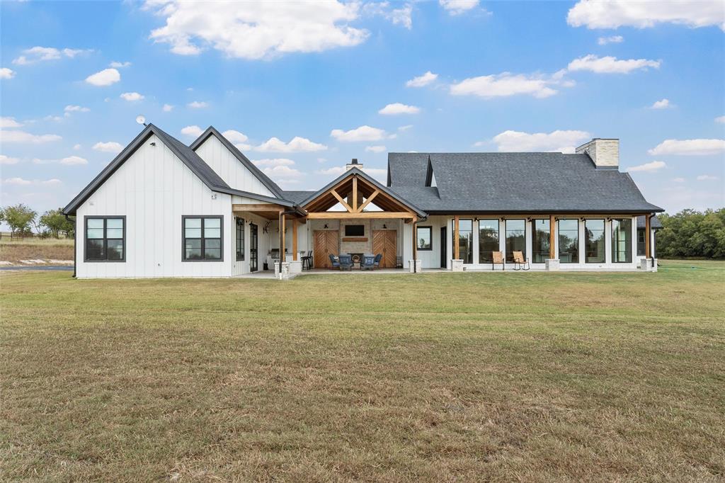 477 Wolf Creek Road Lorena, TX 76655 - Photo 30 of 40 a front view of a house with a garden