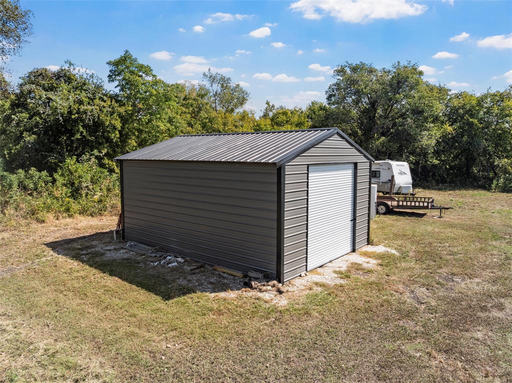 477 Wolf Creek Road Lorena, TX 76655 - Photo 31 of 40 a front view of a house with a yard