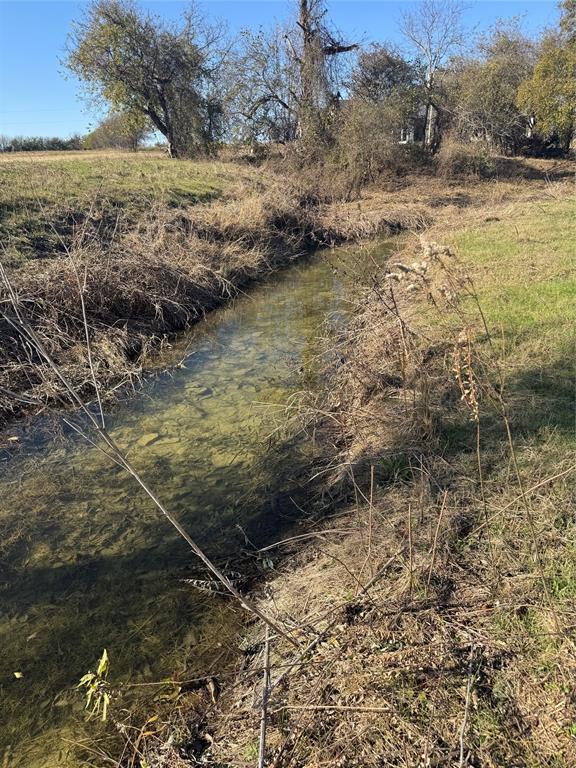 477 Wolf Creek Road Lorena, TX 76655 - Photo 38 of 40 a view of a yard with an outdoor space