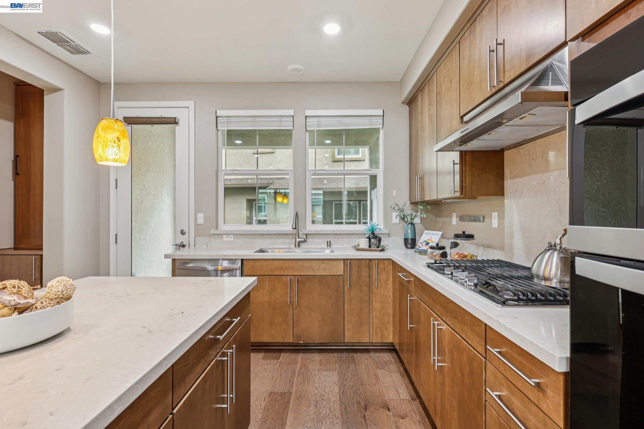 4022 Windsor Way Dublin, CA 94568 - Photo 11 of 55 a kitchen with a sink stove and cabinets