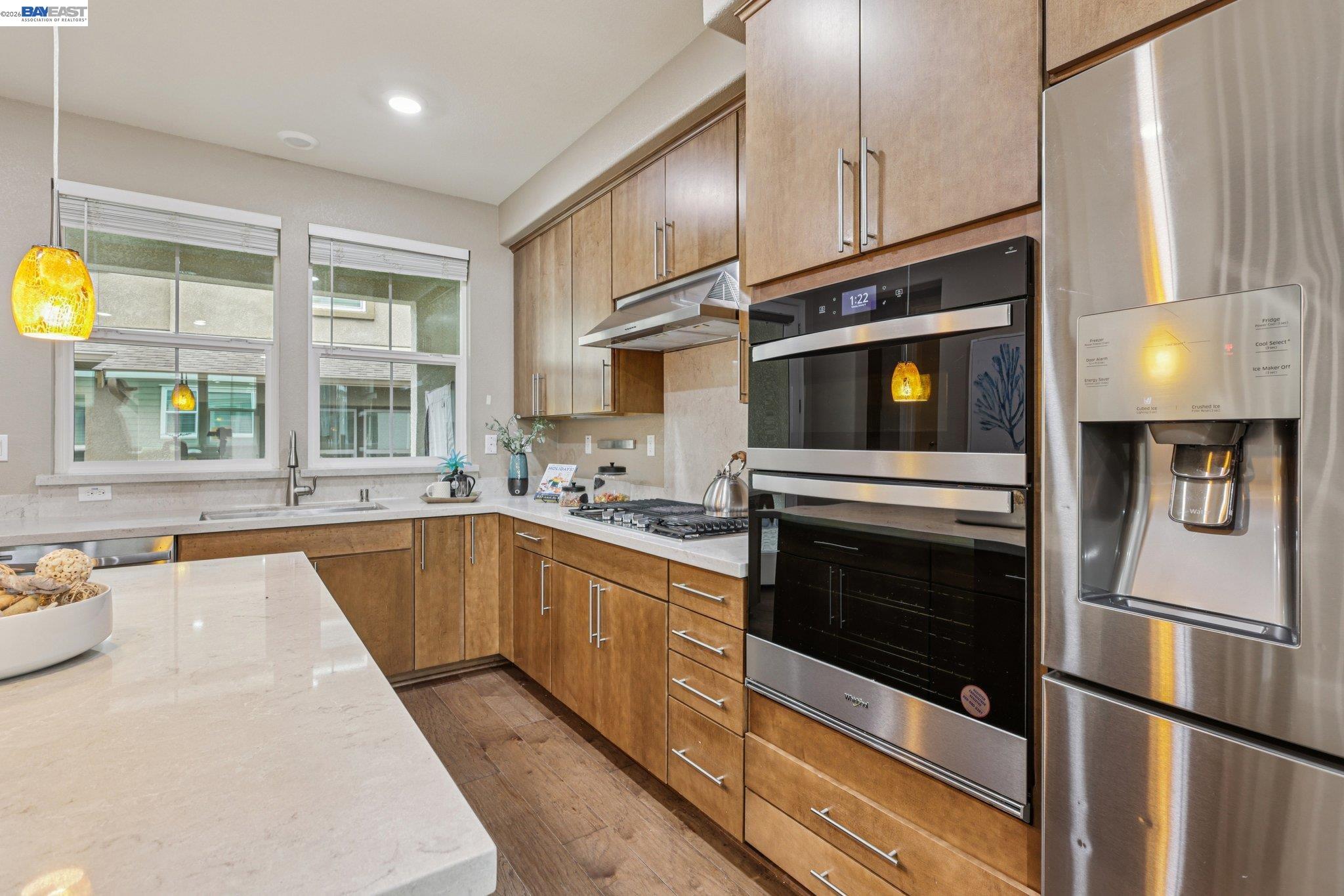 4022 Windsor Way Dublin, CA 94568 - Photo 12 of 55 a kitchen with stainless steel appliances a stove a sink and a microwave