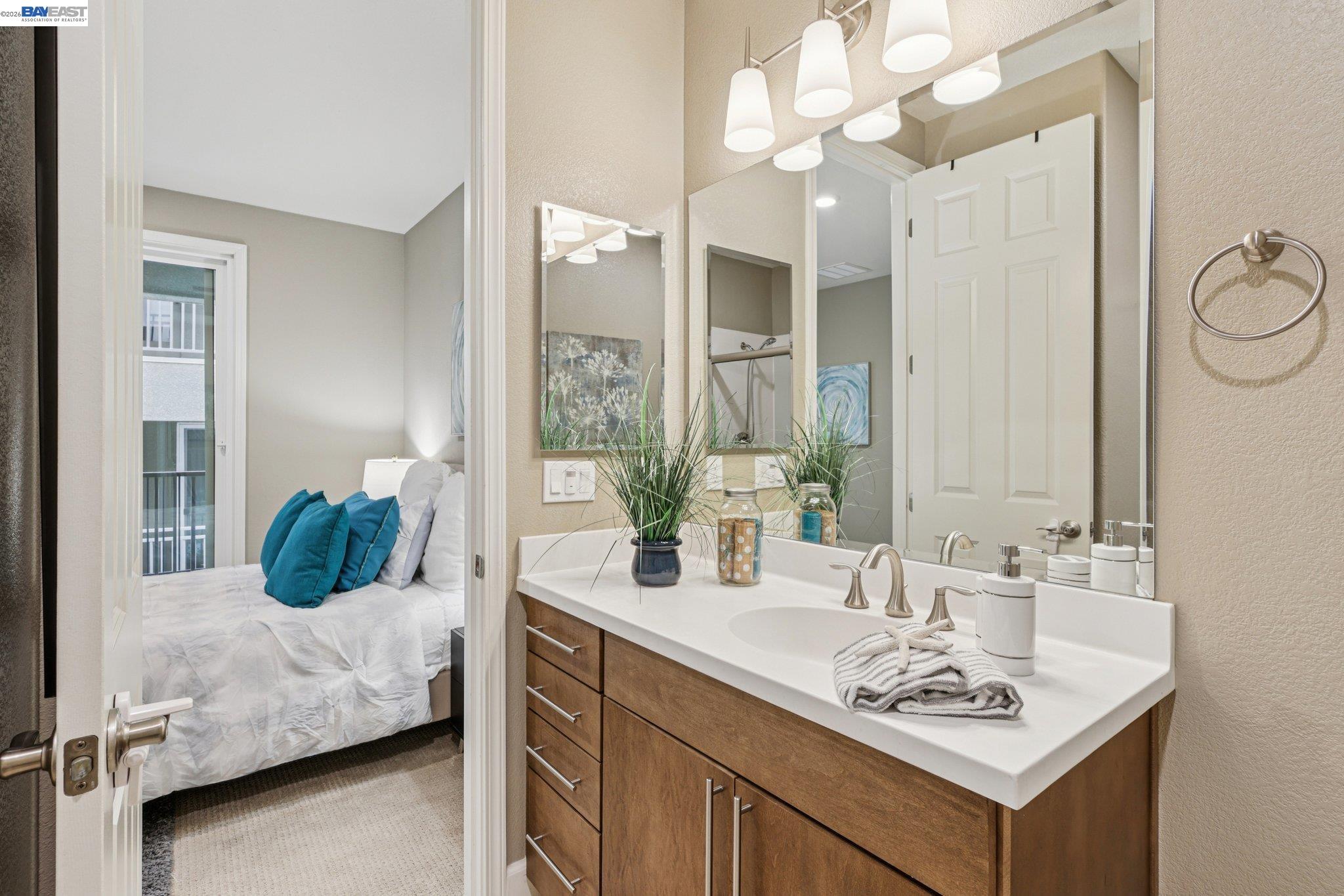 4022 Windsor Way Dublin, CA 94568 - Photo 15 of 55 a en suite bathroom with a double vanity sink and a mirror