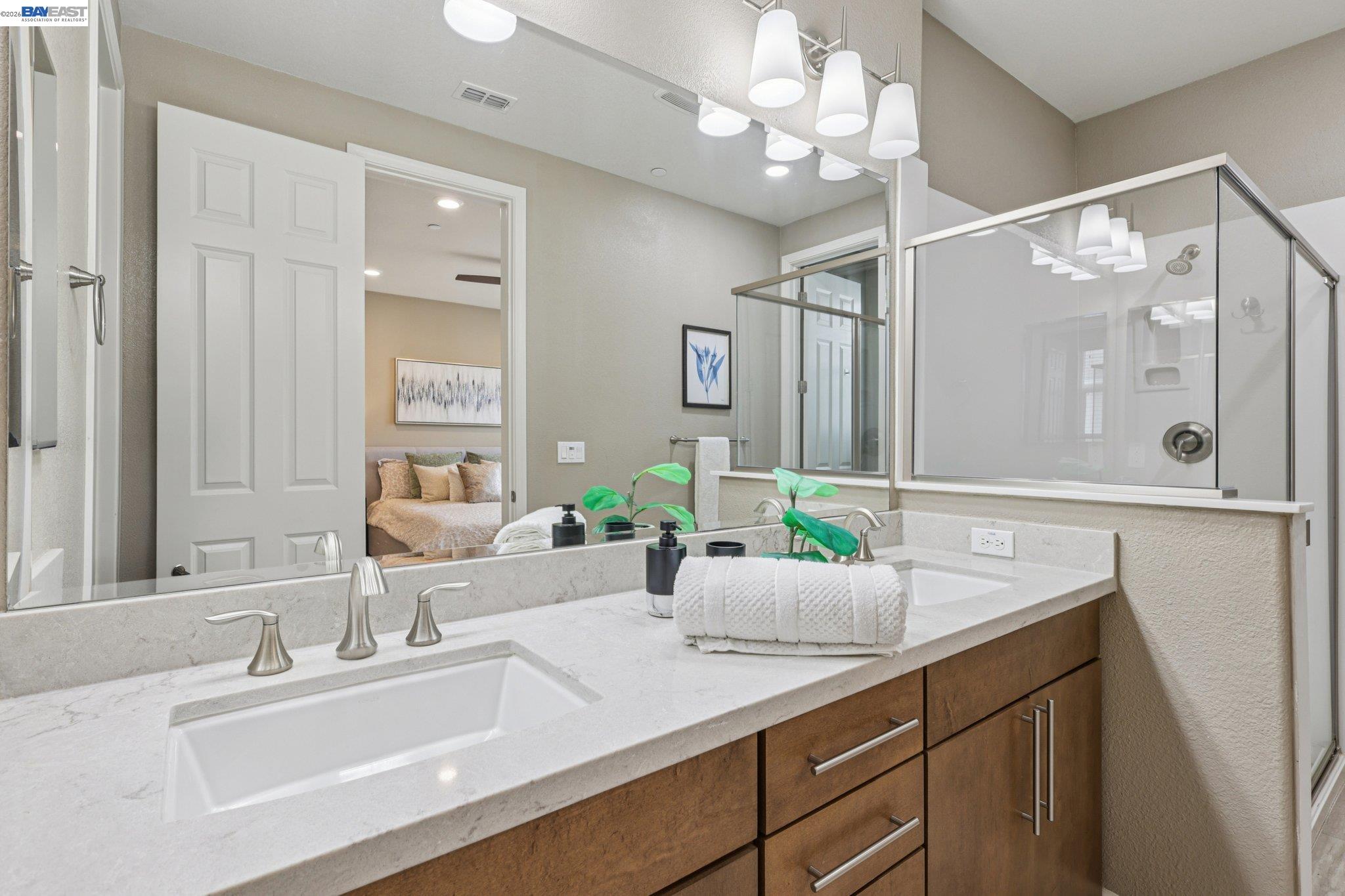 4022 Windsor Way Dublin, CA 94568 - Photo 18 of 55 a bathroom with a sink double vanity and a mirror