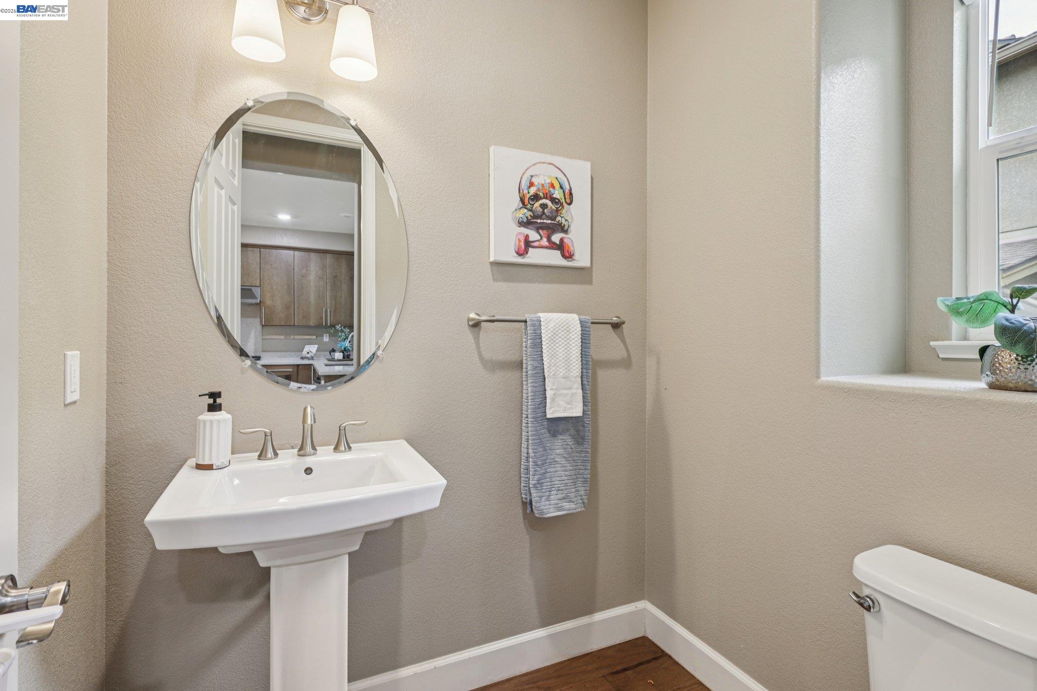 4022 Windsor Way Dublin, CA 94568 - Photo 19 of 55 a bathroom with a sink mirror and toilet