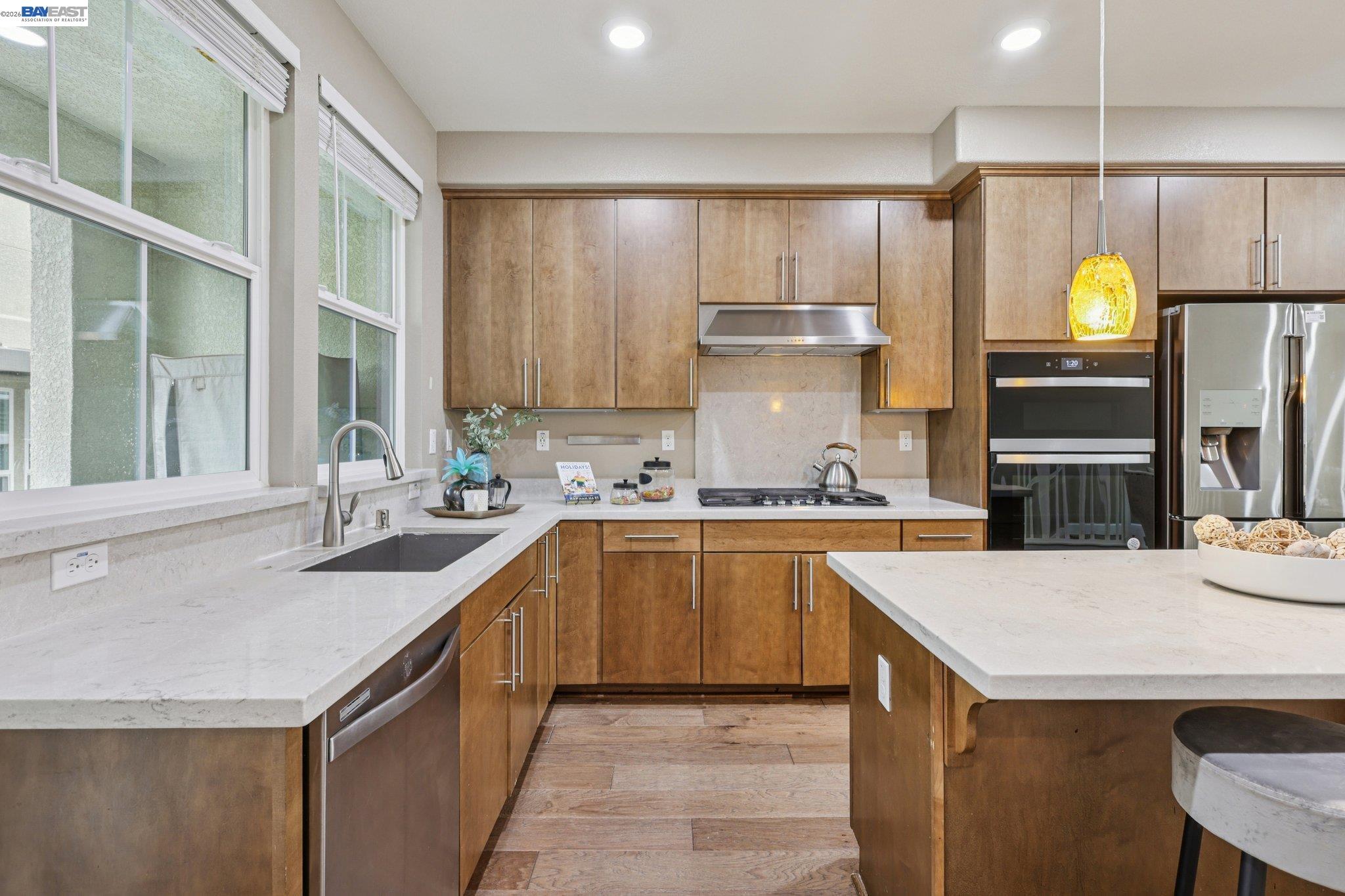 4022 Windsor Way Dublin, CA 94568 - Photo 7 of 55 a kitchen with a sink a stove and cabinets