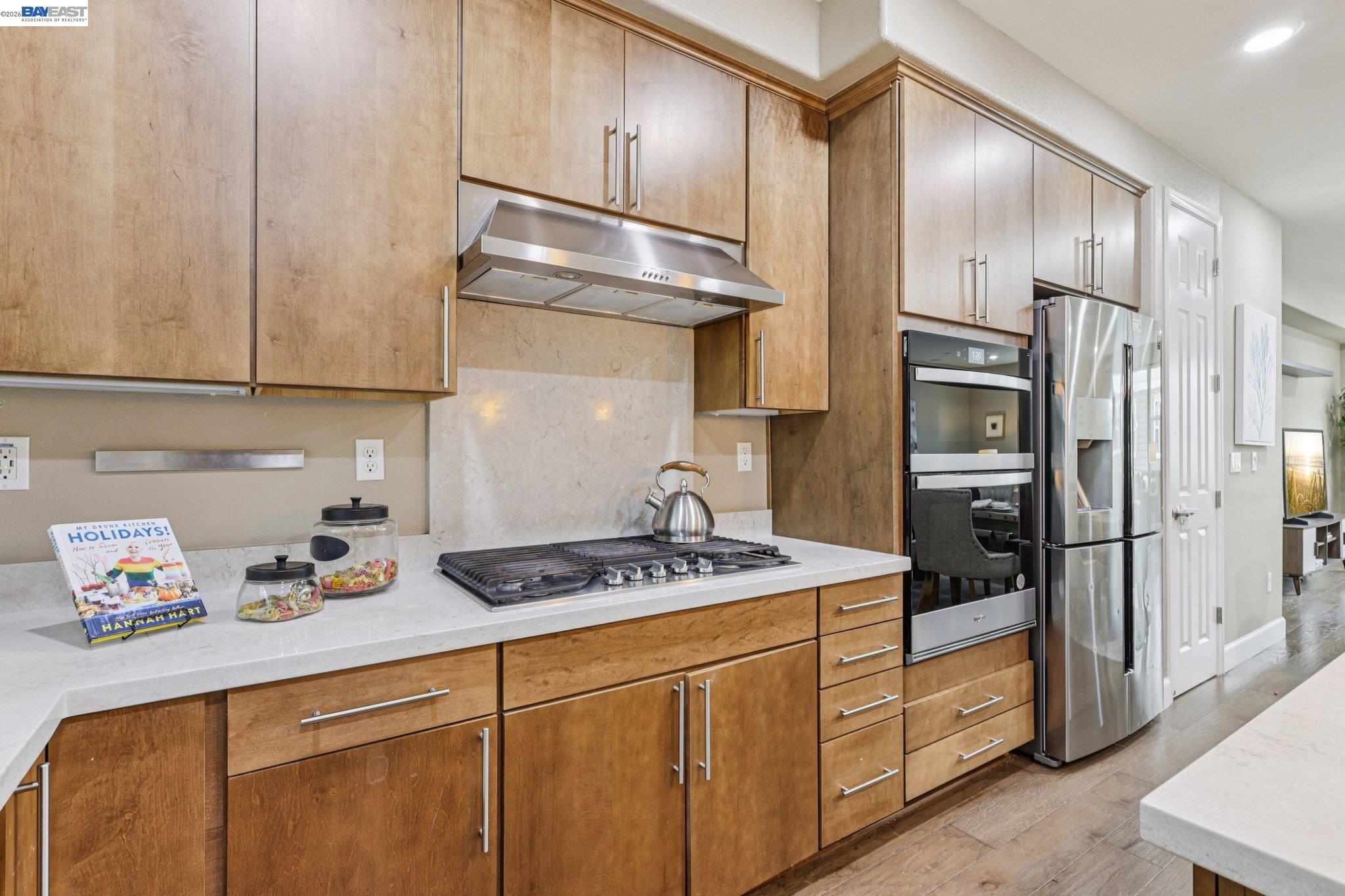 4022 Windsor Way Dublin, CA 94568 - Photo 10 of 55 a kitchen with stainless steel appliances granite countertop a refrigerator sink and stove