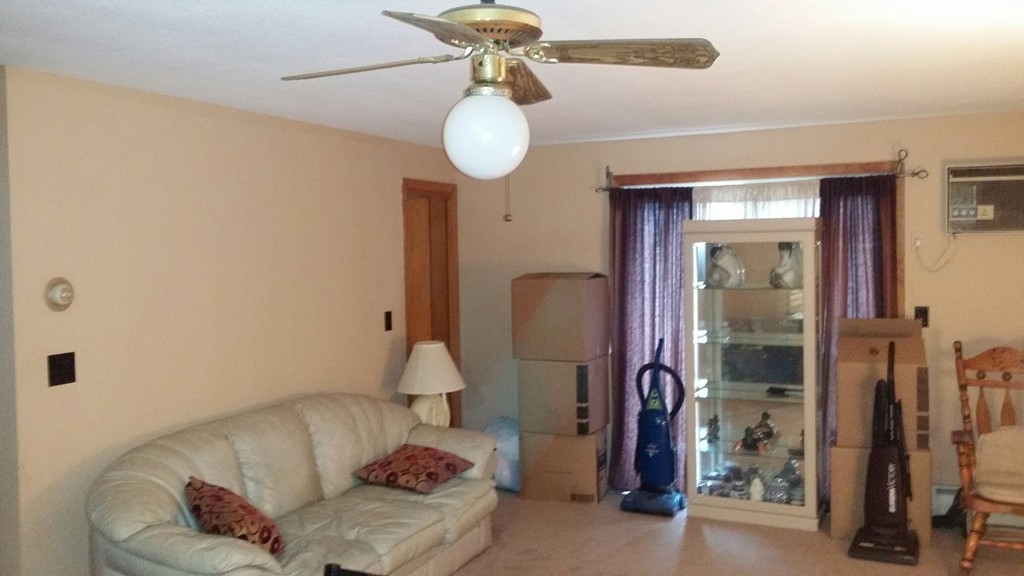 11 Jacqueline Road, Unit D Waltham, MA 02452 - Photo 3 of 13 a living room with furniture
