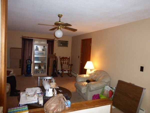 11 Jacqueline Road, Unit D Waltham, MA 02452 - Photo 6 of 13 a living room with furniture flowerpot and a window