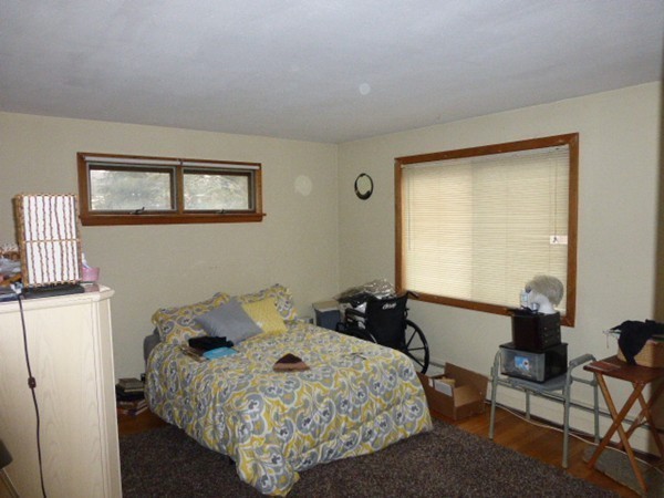 11 Jacqueline Road, Unit D Waltham, MA 02452 - Photo 8 of 13 a bedroom with a bed and a window