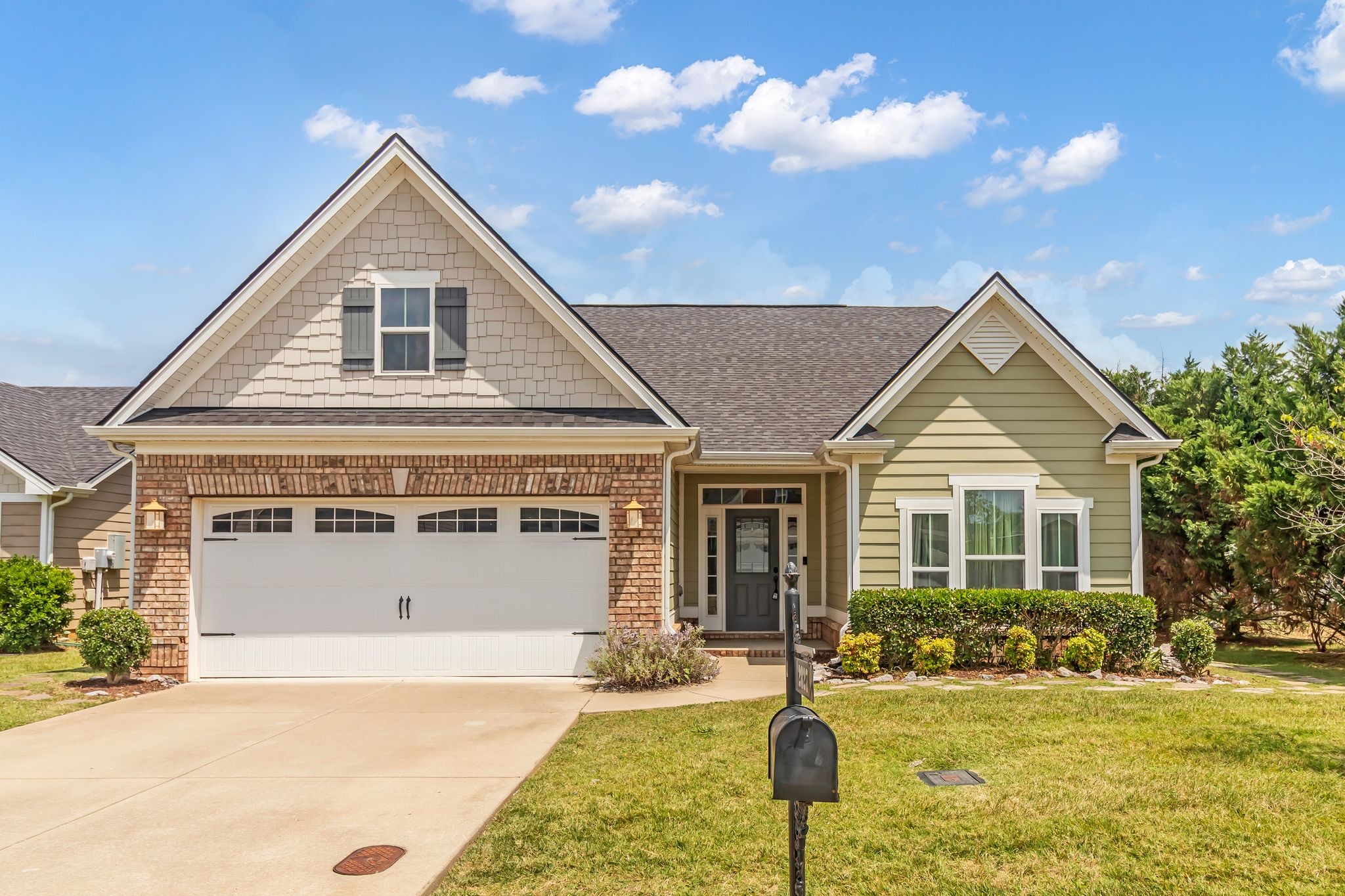 2827 Kellner Drive Murfreesboro, TN 37128 - Photo 1 of 26 a front view of a house with a yard and garage