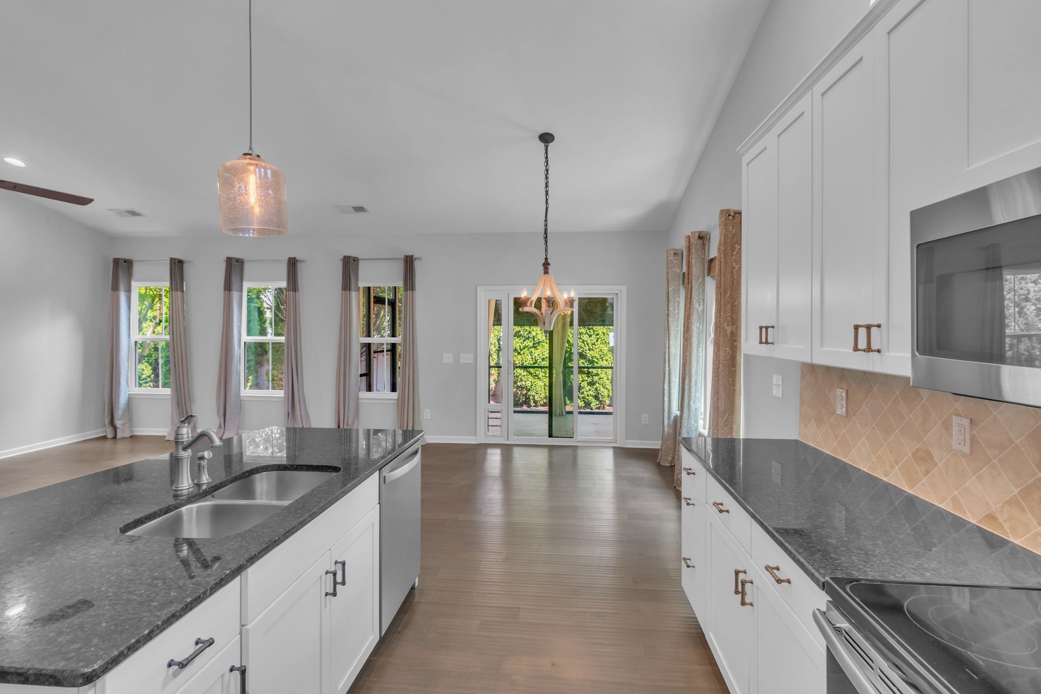 2827 Kellner Drive Murfreesboro, TN 37128 - Photo 13 of 26 a kitchen with granite countertop a sink a counter top space appliances and cabinets