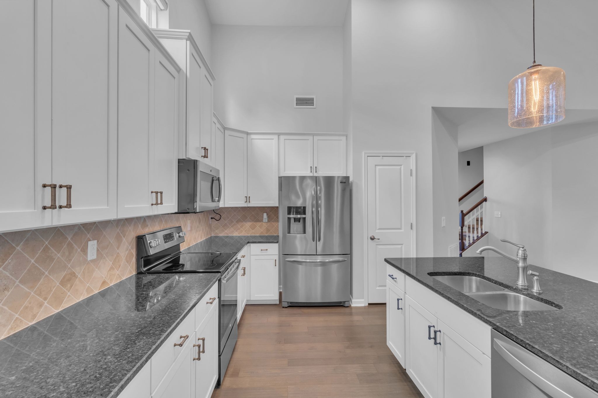 2827 Kellner Drive Murfreesboro, TN 37128 - Photo 14 of 26 a kitchen with granite countertop a sink stainless steel appliances and cabinets