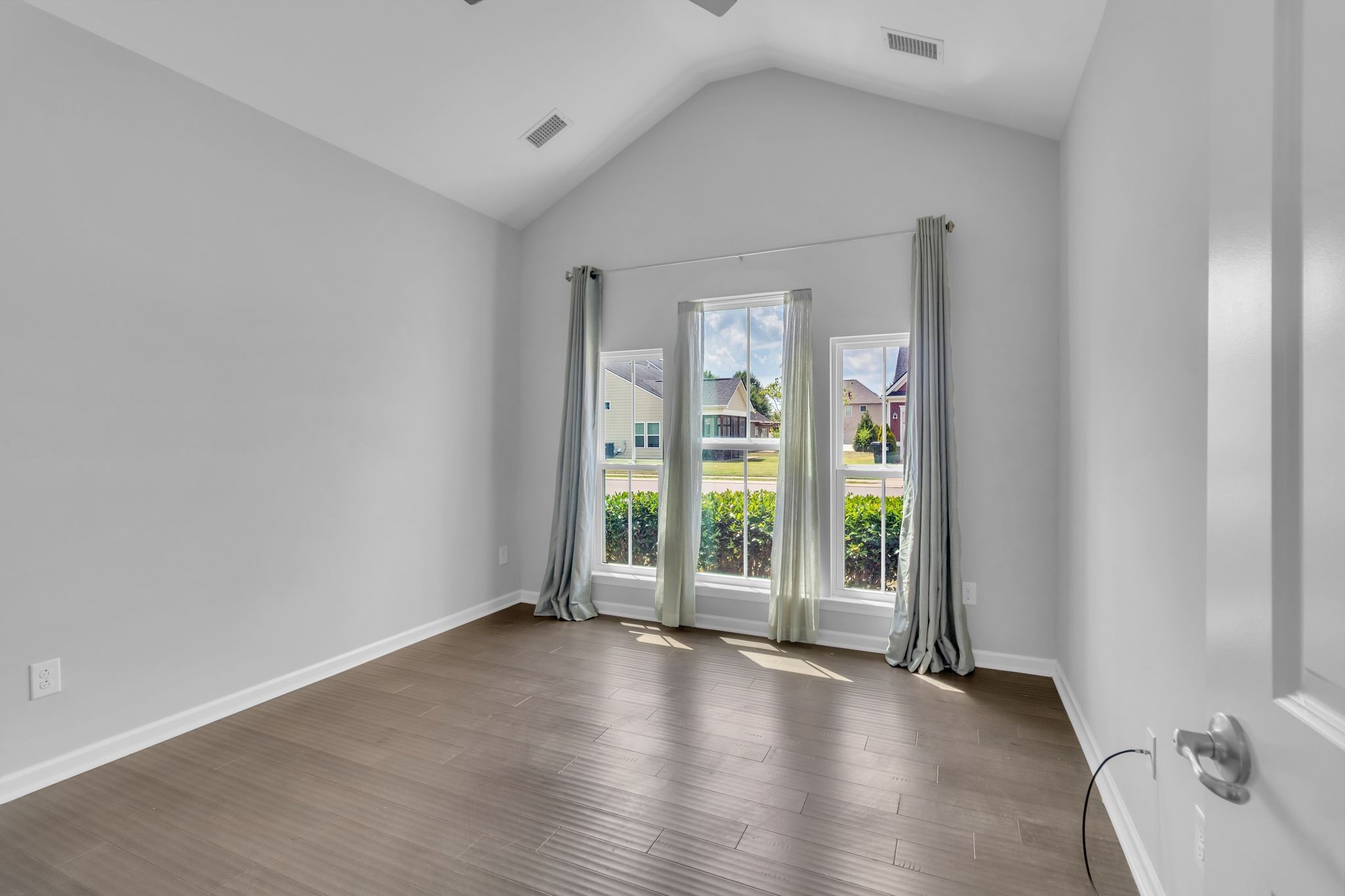 2827 Kellner Drive Murfreesboro, TN 37128 - Photo 8 of 26 an empty room with wooden floor and windows