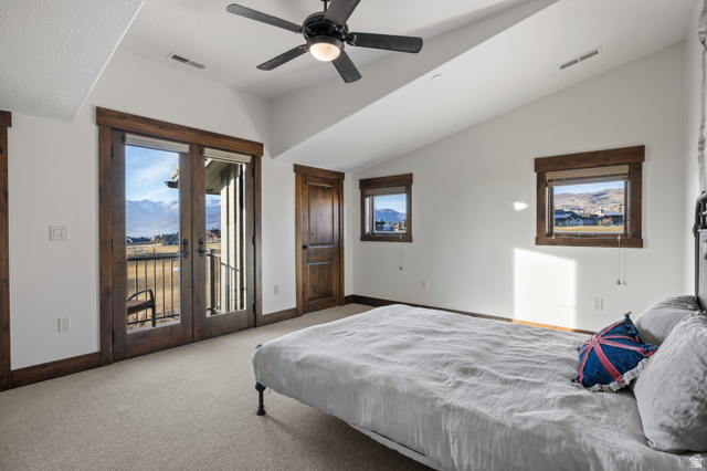 707 Chimney Rock Road, Unit 247 Heber City, UT 84032 - Photo 26 of 64 Bedroom featuring carpet, access to exterior, french doors, a ceiling fan, and lofted ceiling