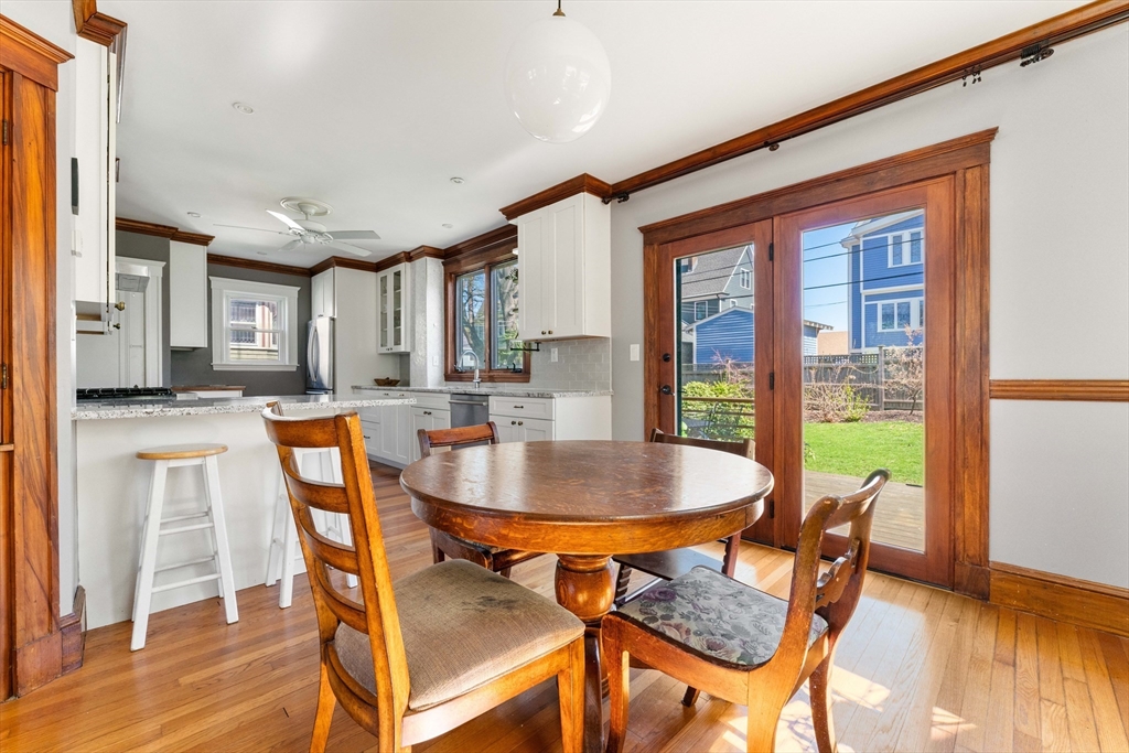 136 Beech Street Boston, MA 02131 - Photo 12 of 40 a dining room with furniture and wooden floor