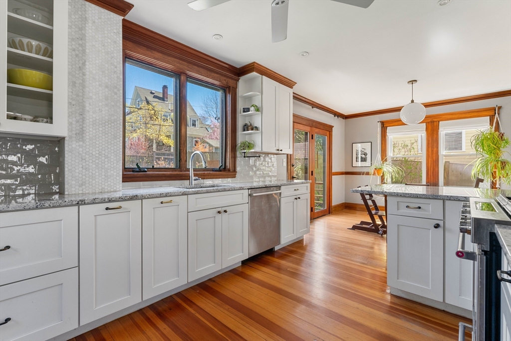 136 Beech Street Boston, MA 02131 - Photo 13 of 40 a large kitchen with lot of counter space and windows