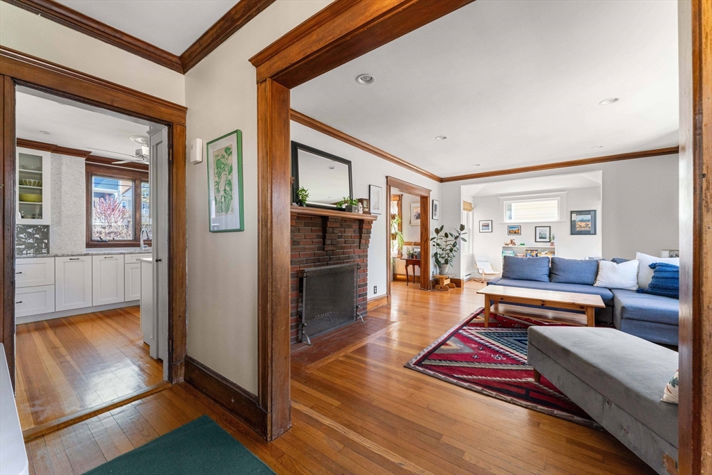 136 Beech Street Boston, MA 02131 - Photo 18 of 40 a living room with furniture and a fireplace