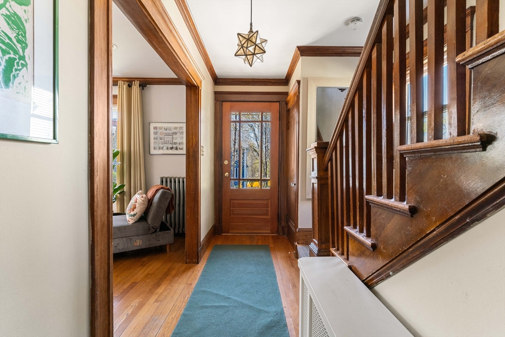 136 Beech Street Boston, MA 02131 - Photo 19 of 40 a hallway with furniture and a window