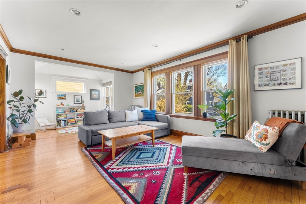 136 Beech Street Boston, MA 02131 - Photo 2 of 40 a living room with furniture and a large window